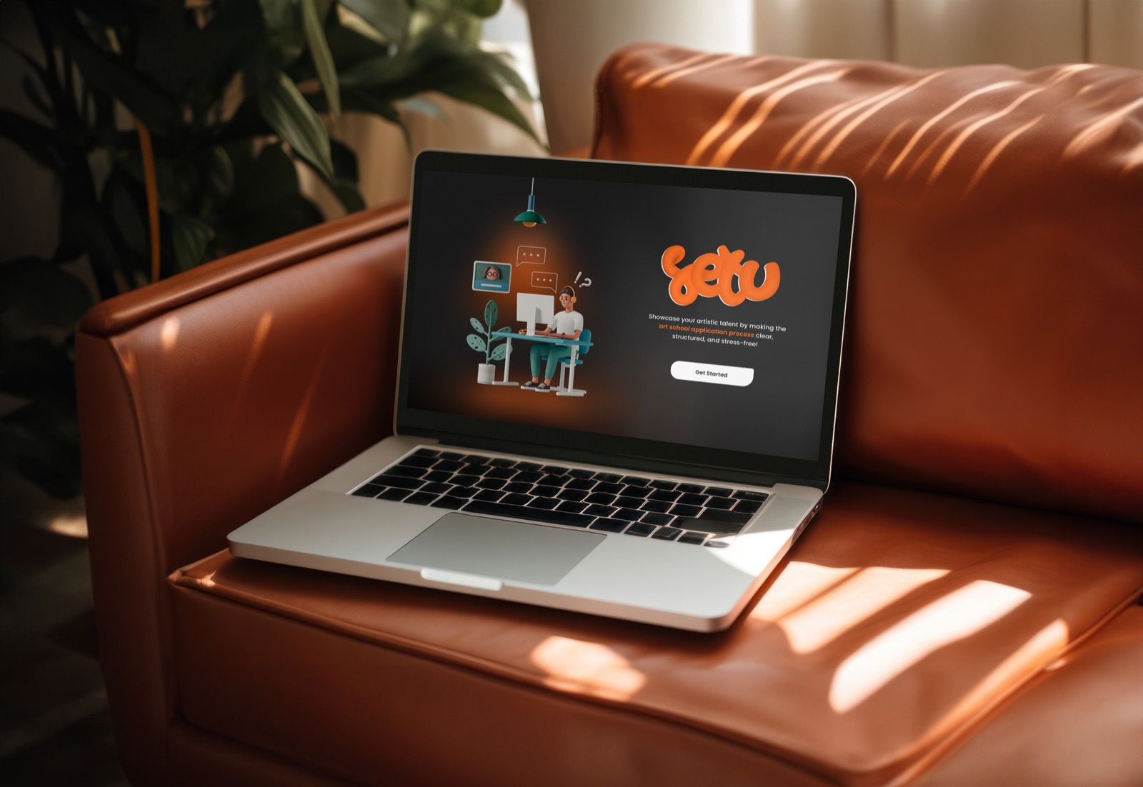 Setu open on a laptop on a leather sofa.
